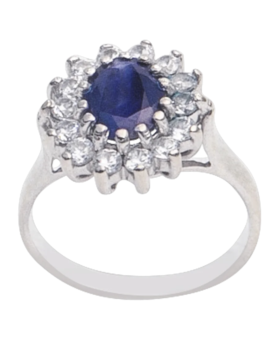 De CHARMANTE MARGUERITE ring, met zijn saffier en diamanten is onvergetelijk. De CHARMANTE MARGUERITE ring, met zijn saffier en diamanten is onvergetelijk.