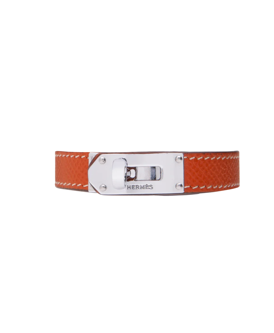 Bracelet from the luxury house Hermès in Steel and orange Leather. Available at VIRTU LUXURY. Bracelet from the luxury house Hermès in Steel and orange Leather. Available at VIRTU LUXURY.